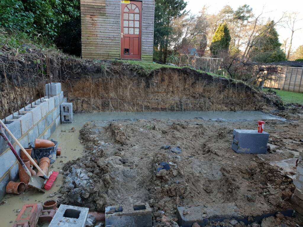 Building Strong in the Cold: A Guide to Foundations, Footings & Retaining Walls This Winter 2 Retaining wall built in a garden